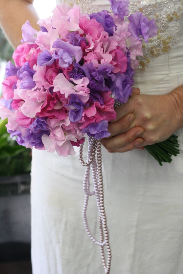 Loose hand tied Romantic wedding bouquet of sweet pea and pearls